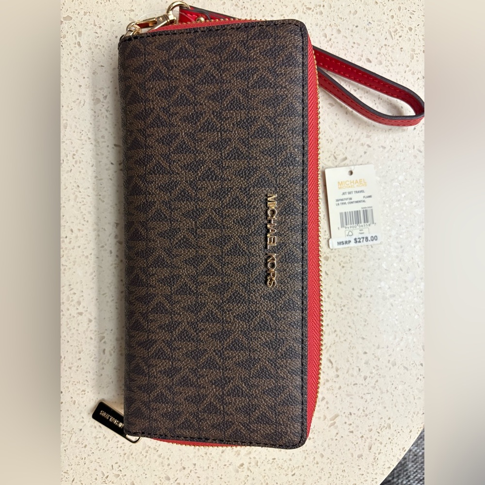 Micheal Kors LG travel continental 
8 1/2 in L x 4 H x 1 1/8 W